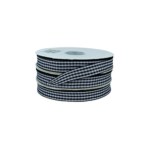 Rollo de cinta vichy a cuadros negra y blanca, ideal para decoraciones profesionales y proyectos comerciales.